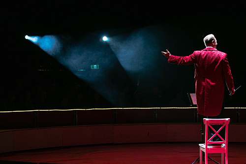 interior design man in red coat stage